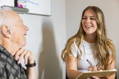 An N A U Psychology student works with a patient at the Healthy Aging Lab.