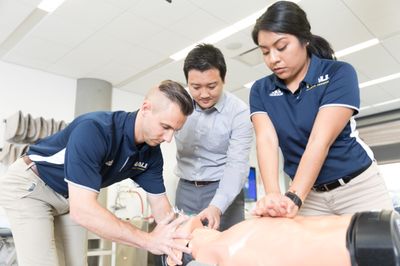 N A U Athletic training students practice C P R.