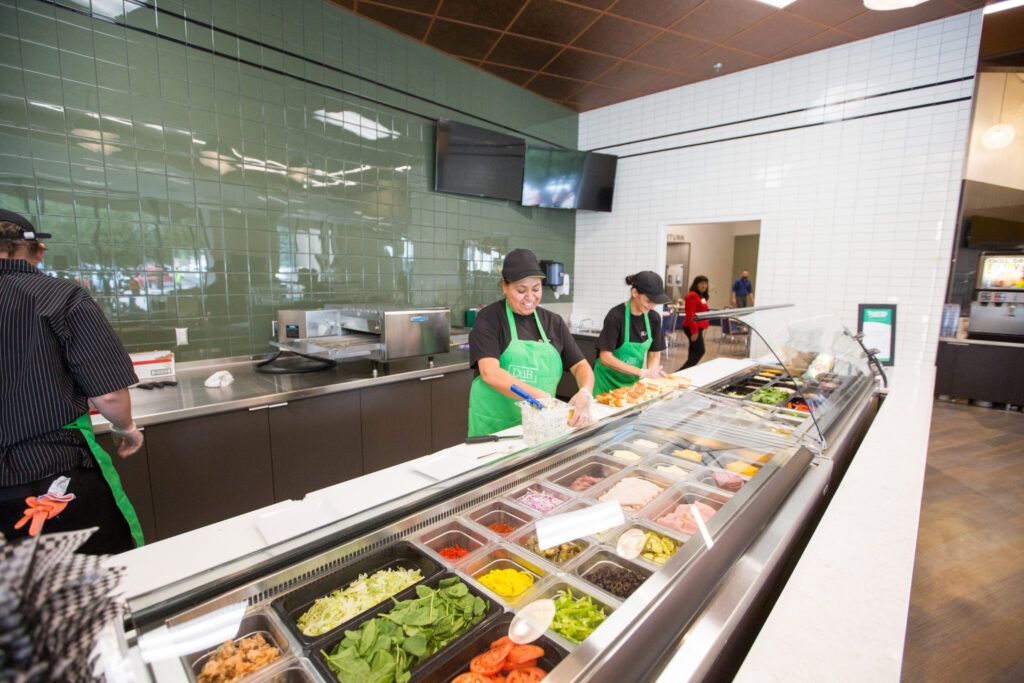 Workers in duBois in the sandwich area at the all-you-care-eat dining location.
