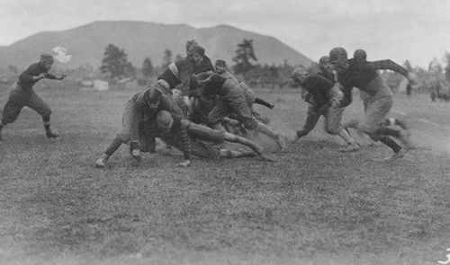 N A U student blockers try to clear a path for a handoff to the back in this 1905 football game on the Athletic Field, later renamed McMullen Field.