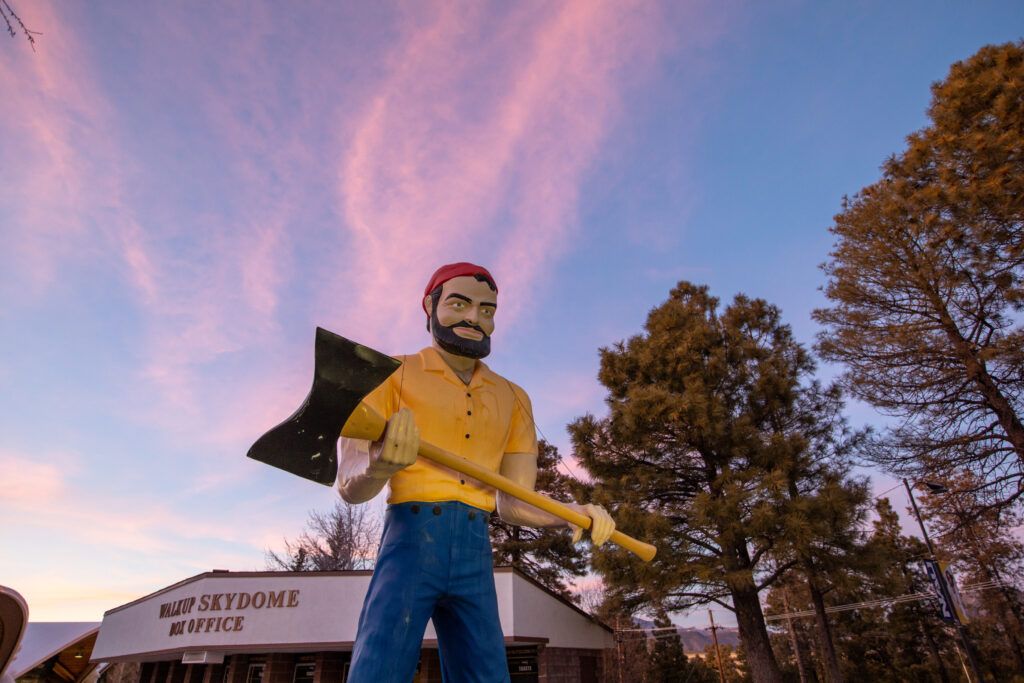 A 25-foot tall Lumberjack statue in front of the Walkup sky dome.