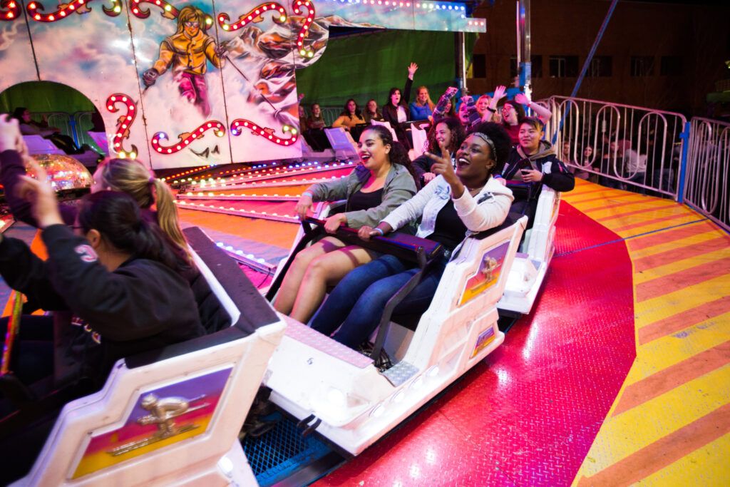 A group of students enjoy a ride at the ASNAU Carnival at N A U's homecoming weekend.